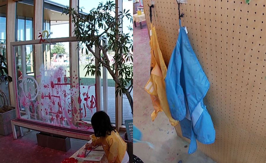 壁に掛かっているエプロンを借りて、ガラスに絵を描くこともできます。